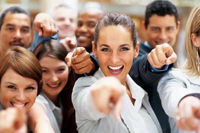 A group of people point to us